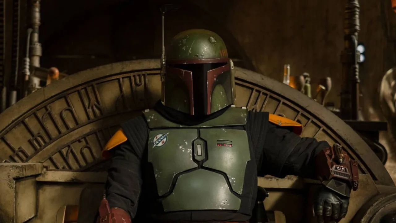 Jawa de plástico da Kenner, 1979, com adesivo amarelo 'Free Boba Fett' ao lado de um selo de leilão