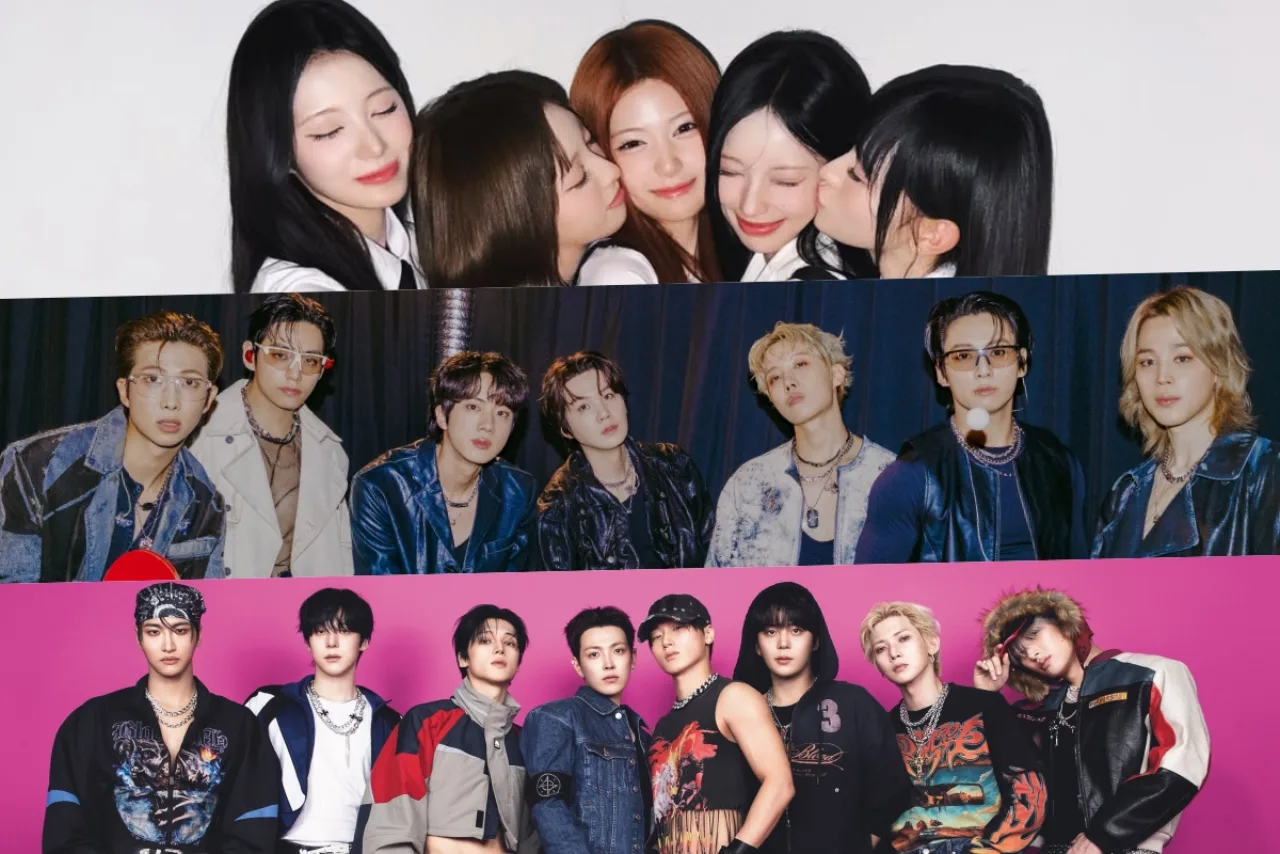 Membros de RESCENE posam sorrindo ao lado de um placar que mostra o topo do ranking de reputação de idols